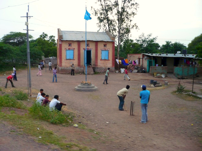 Playing cricket. A very important thing in India.