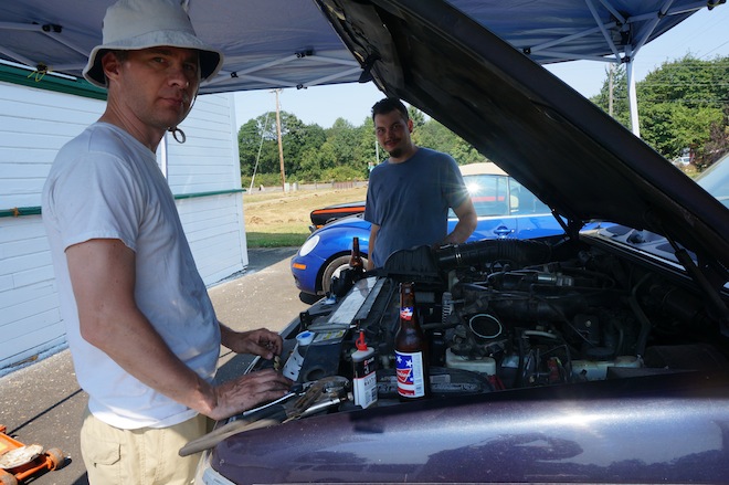 J and J trying to fix the car.